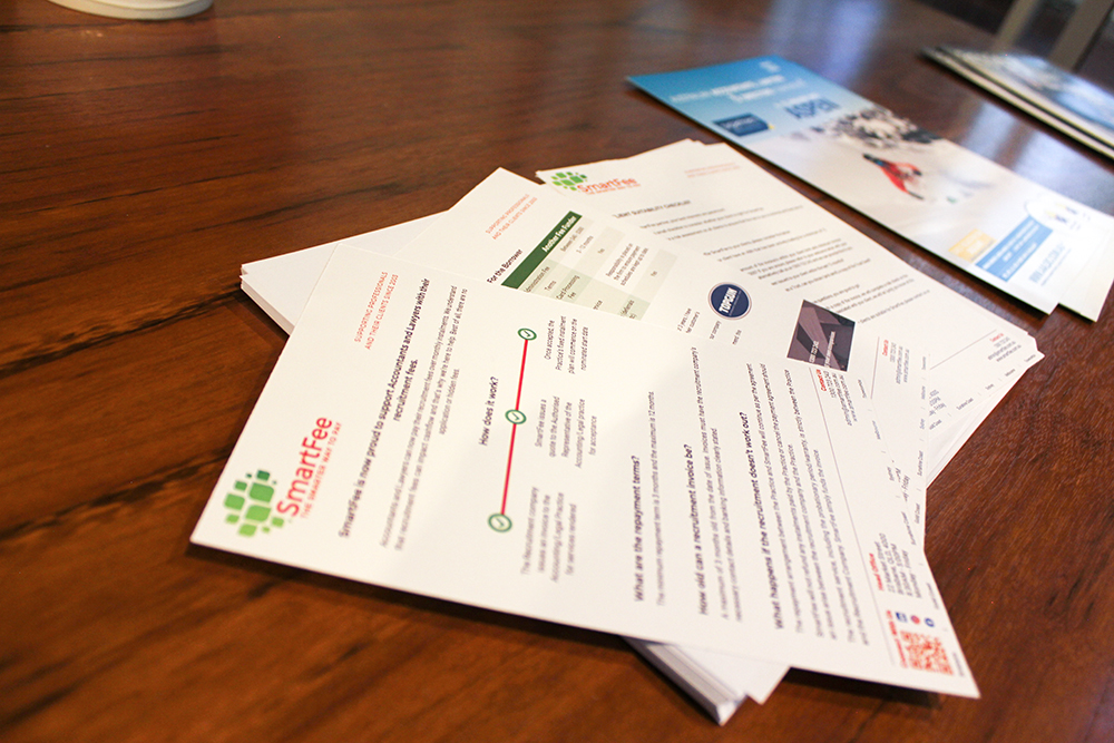 A stack of business flyers A stack of business flyers | SmartFee
